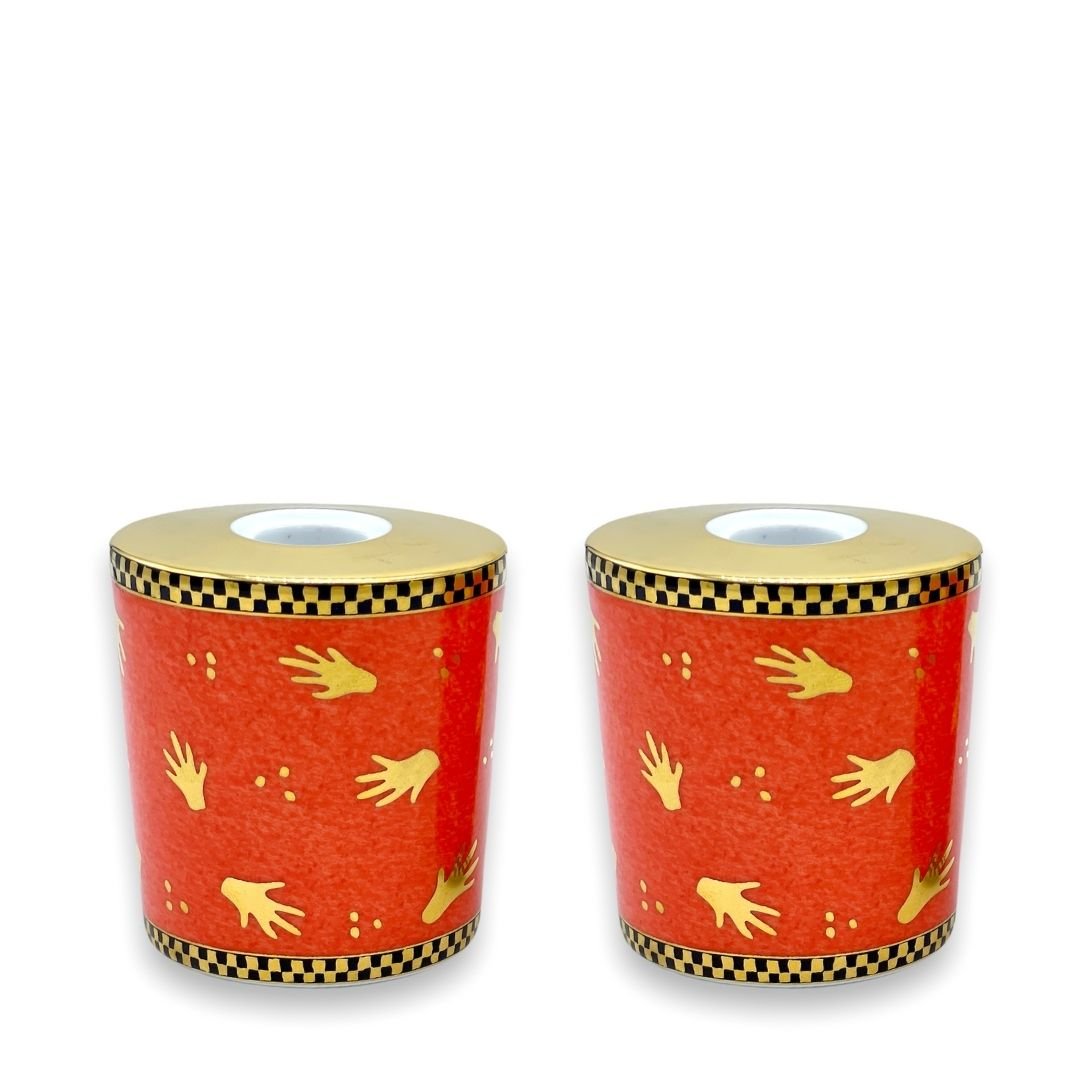Coppia candelieri in porcellana BVLGARI - Rosenthal collezione “Mani al vento” Pair of BVLGARI - Rosenthal porcelain candlesticks, collection 